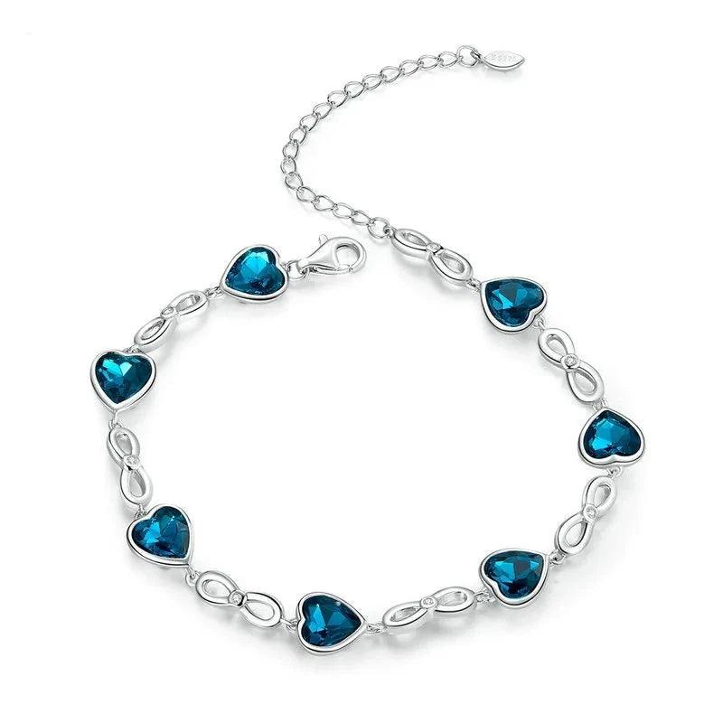 Pulseira de Prata Infinito e Coração Azul: Elegância e Simbolismo para seu Look - ORIENTE PRIME